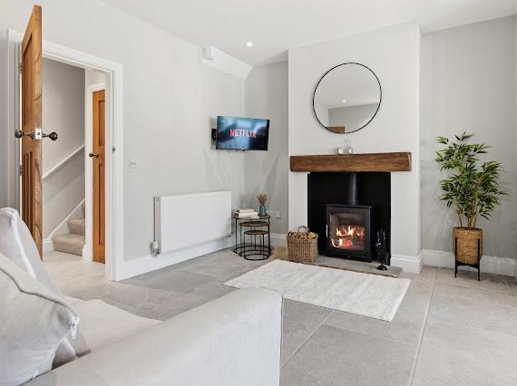 Styled living room with feature fireplace by MATTAM Property Services