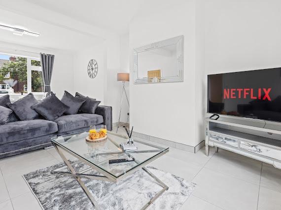 Living room styled with grey velvet sofa and marble coffee table