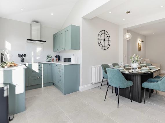 Styled open-plan kitchen and dining area by MATTAM Property Services